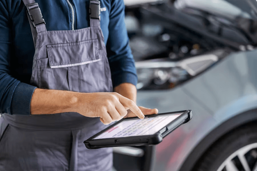 Mechanic booking a service on a tablet