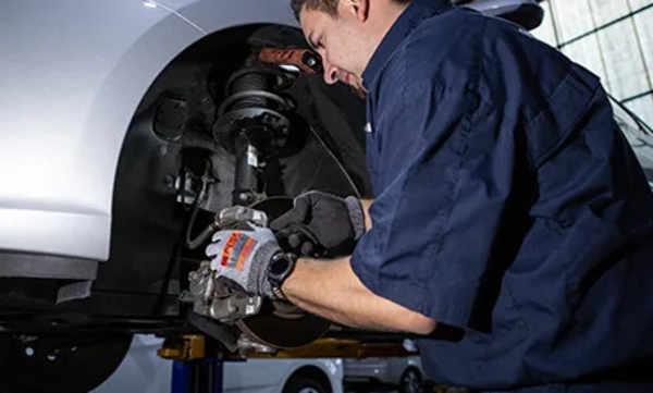 Mechanic changing brake pads